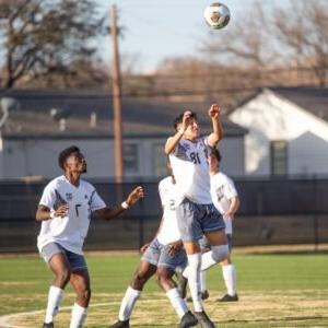 HSU men's soccer team playing.